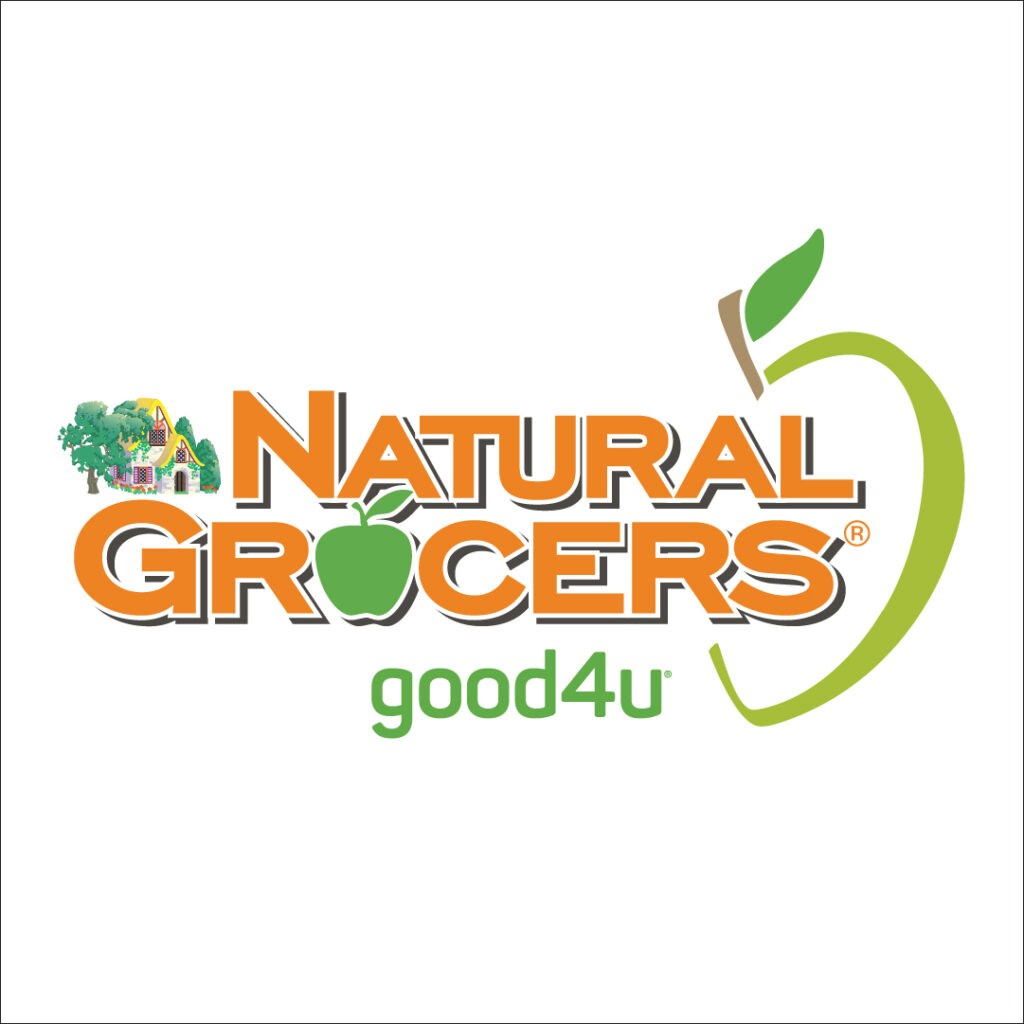 The Natural Grocers’ logo features the words Natural Grocers in orange letters with a green apple beside it and a small cartoon of a stone house with a straw roof surrounded by trees.