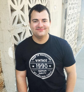 man smiling wearing black t shirt