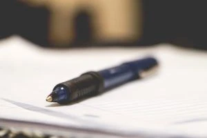 Closeup of a pen on top of a notepad