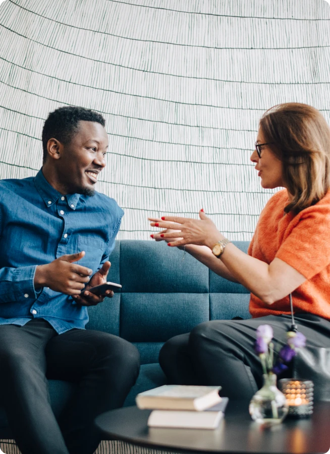 Two people talking in an office.