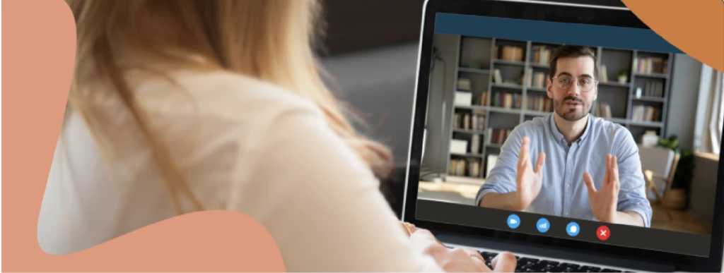 Person watching webinar video on computer