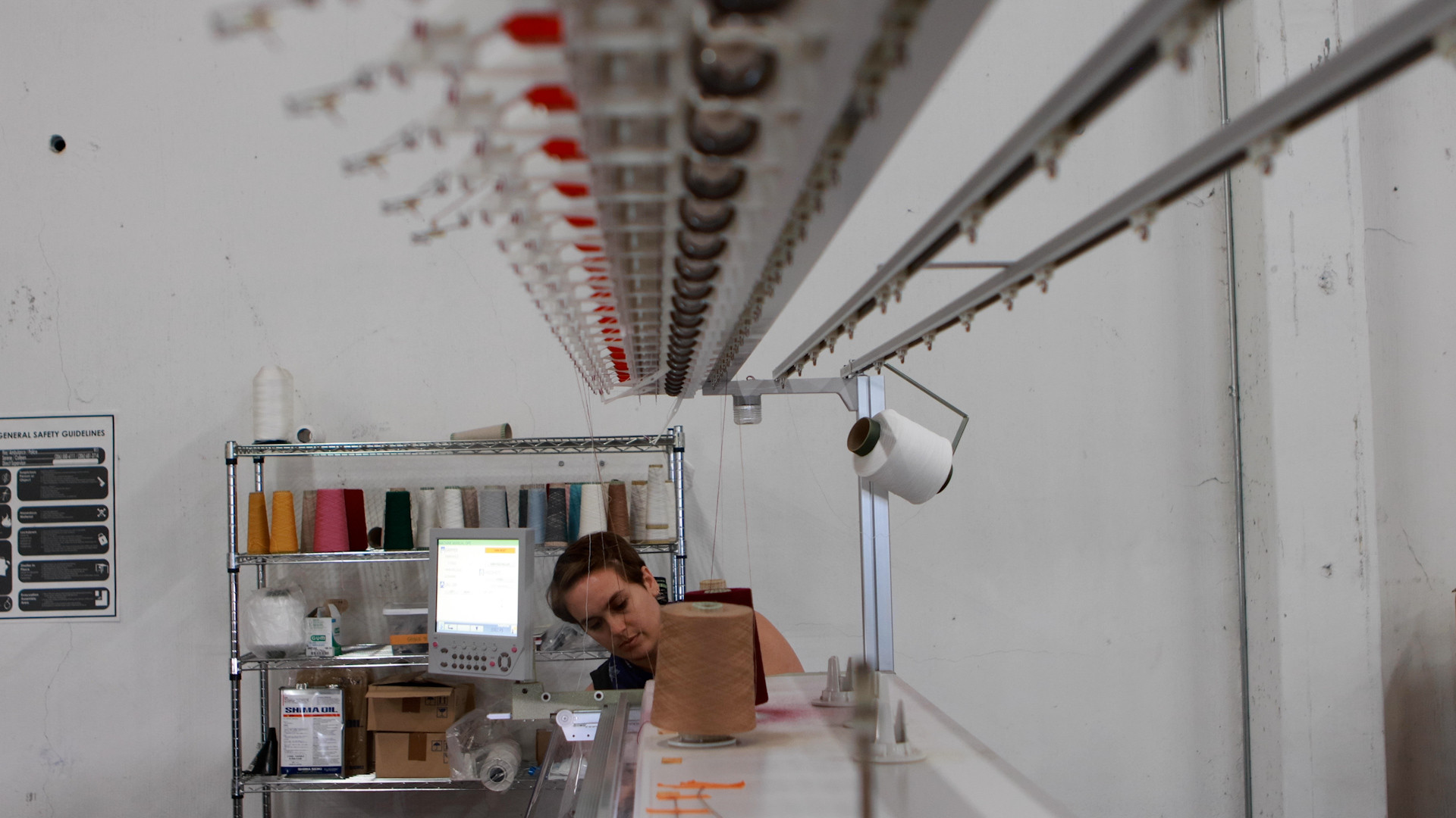 eighth generation employee working on textiles