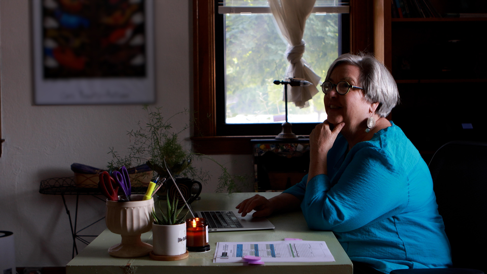 brilliant detroit ceo working on laptop in a dark office
