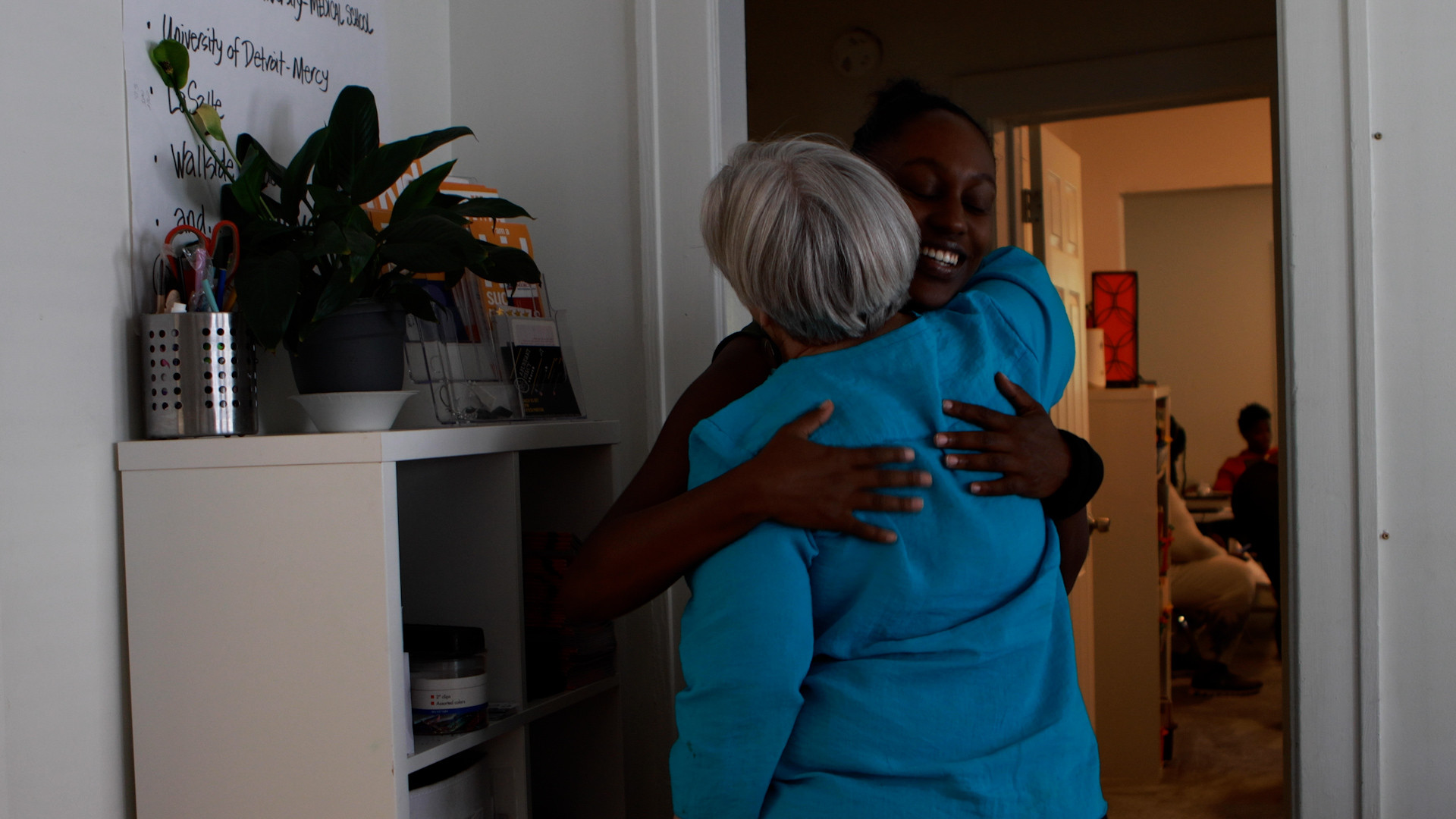 brilliant detroit ceo hugging employee