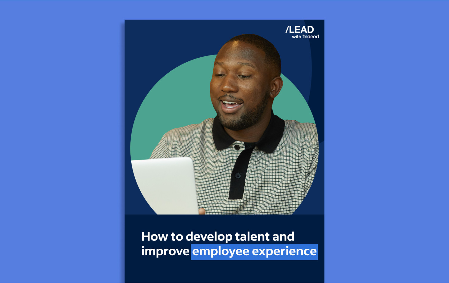 A man gleefully stares at his laptop.