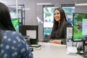 Smiling customer at reception desk