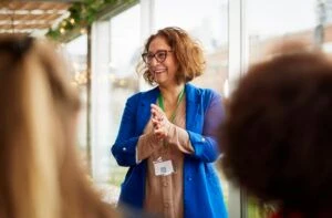 Asian businesswoman talking at women's seminar