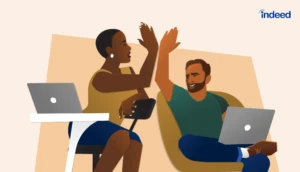 An employer high-fiving an employees hand