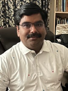 Shivashis posing for a photo
