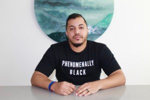 Cristian sitting for a photo 