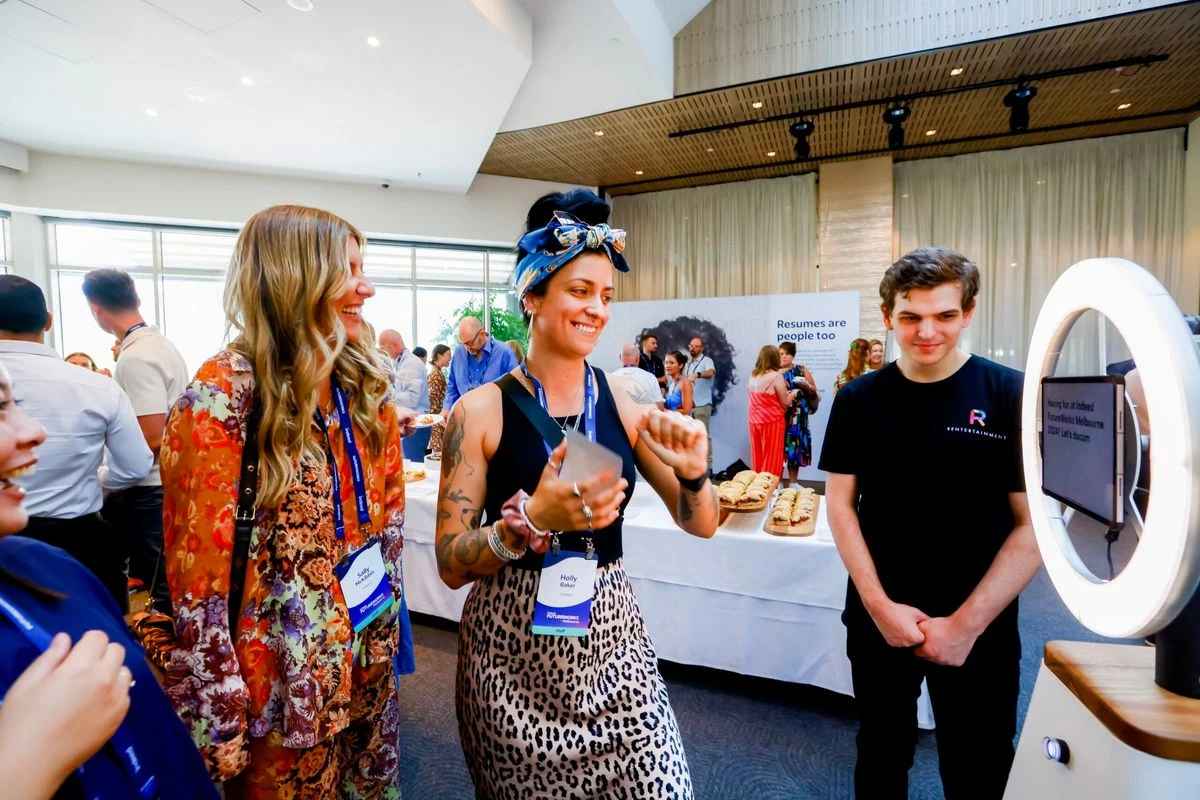 Attendees at a networking event engage with a demonstration