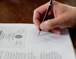 A person signing a certificate.