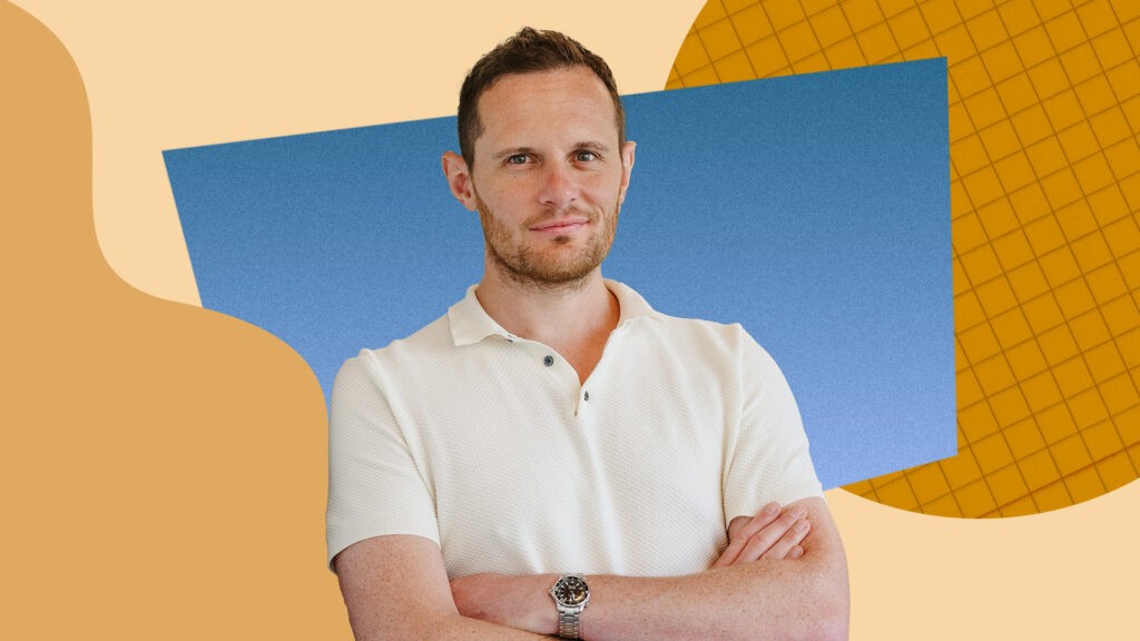Photo of Jack Kennedy, Senior Economist at Indeed Hiring Lab, in front of a colorful background.