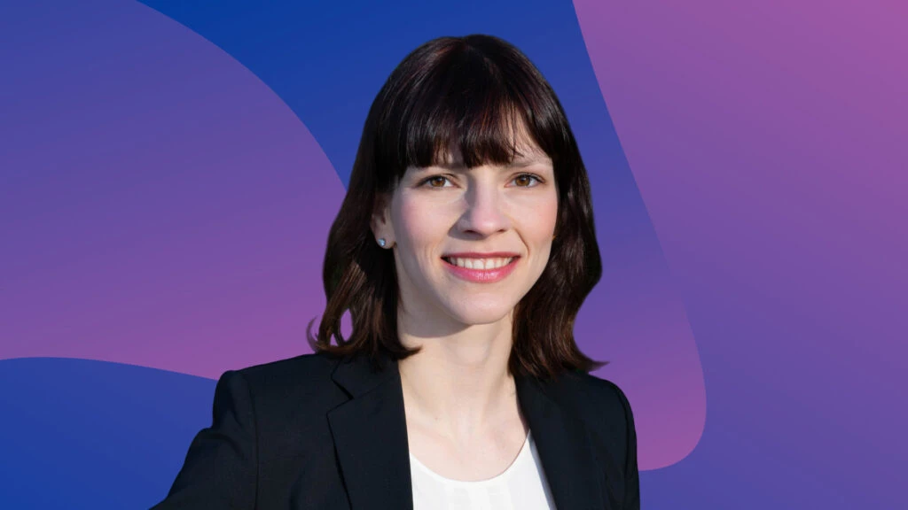 Featured image of Virginia Sondergeld, Economist at Indeed Hiring Lab, set against a colorful background.