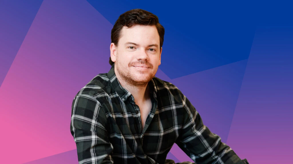 Image of Callam Pickering, Economist at Indeed Hiring Lab, set against a colorful background.