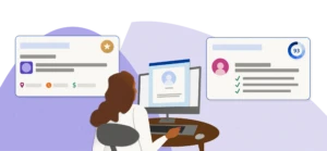 A woman sitting a desk browsing Indeed looking at job listings and candidate profiles.