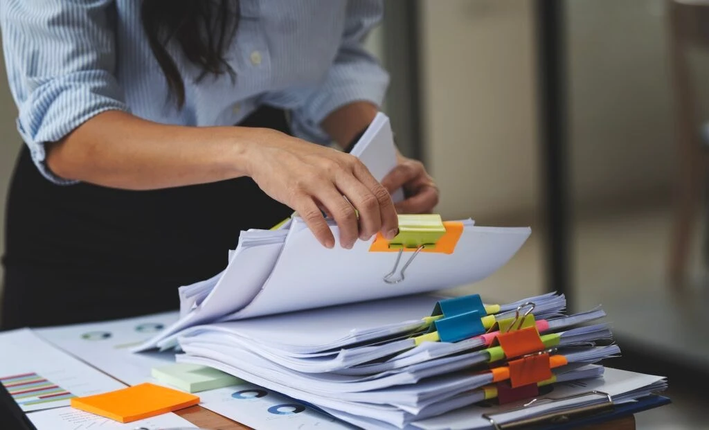 Working through stacks of paperwork in the office