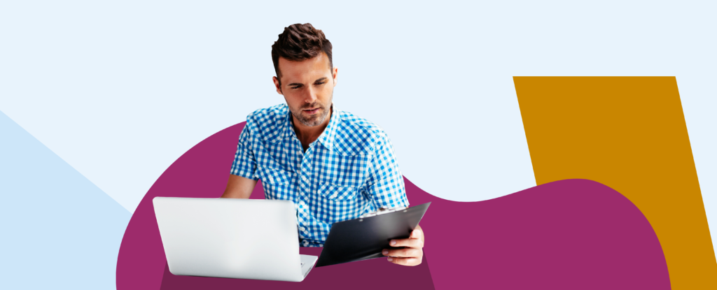 Man sitting at a laptop and reading