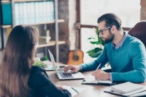 Two people collaborating in an office