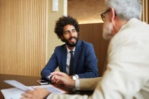 Two people having a discussion in an office