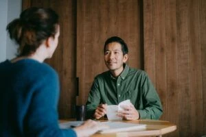 Man and woman having a small business meeting in smart casual clothes