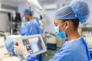 Female surgeon with surgical mask at operating room