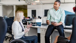 Two employees talking in the office