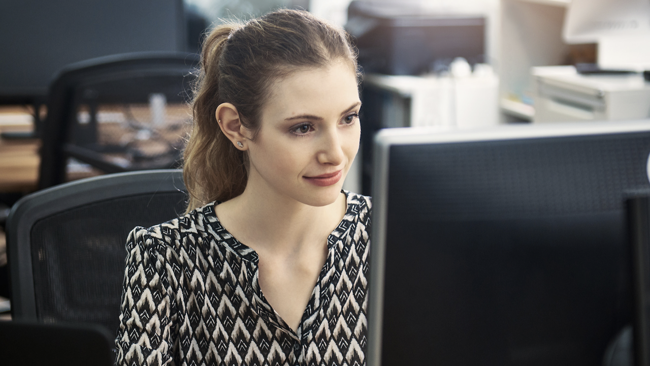 A woman starring at a screen