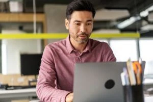 Man working on his laptop in an office