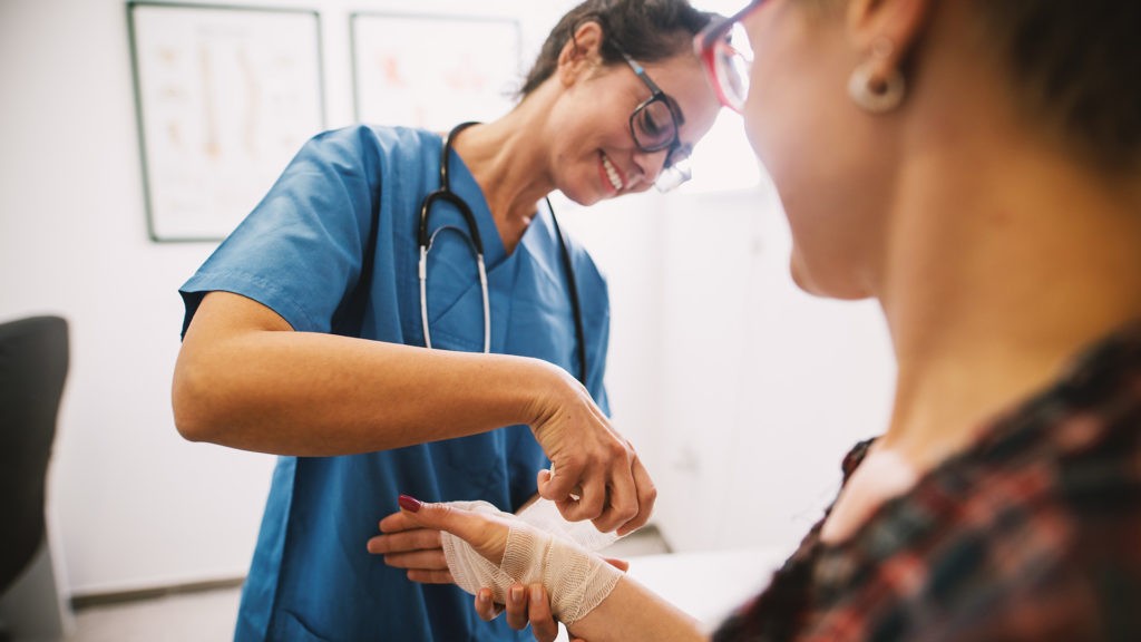 nurse caring for at home patient