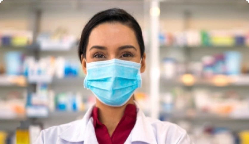 A Walmart pharmaceutical employee wearing face mask
