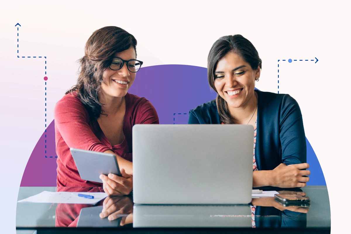 Two women looking at laptop