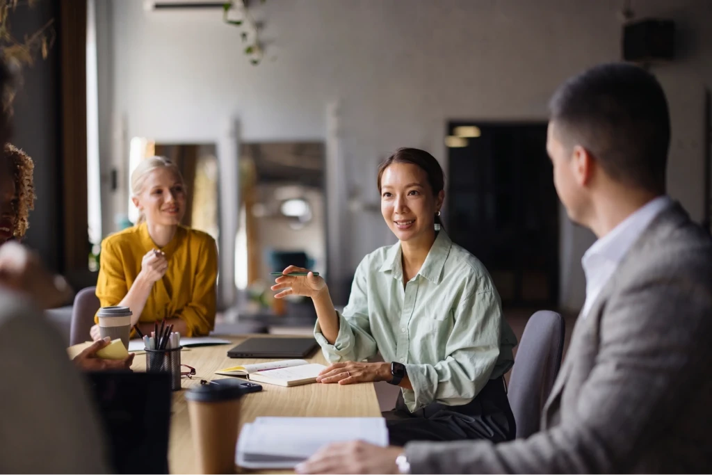 A diverse business team collaborating in an office meeting.