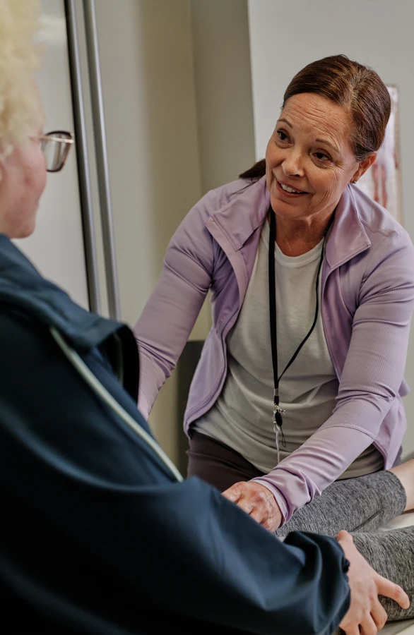 A physical therapist helping a patient