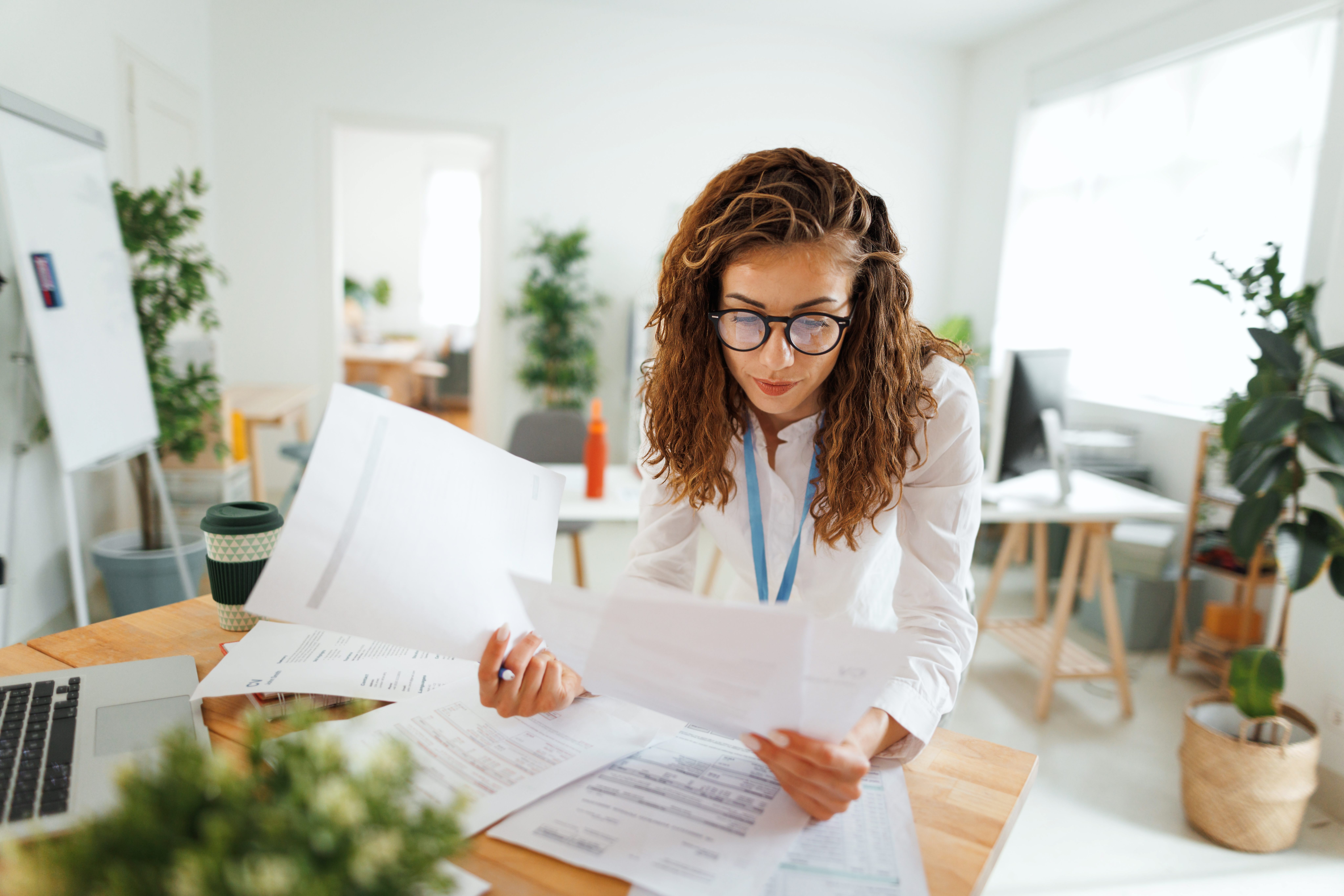 Employee reviewing paperwork in the office