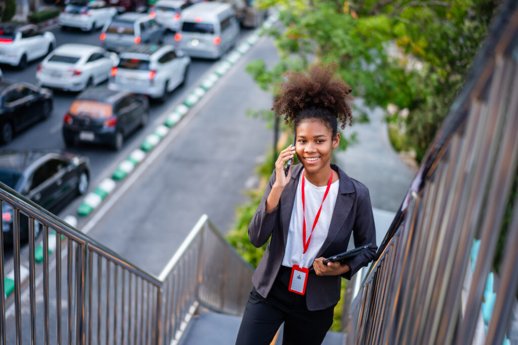 Cheerful young businessperson talking on the phone