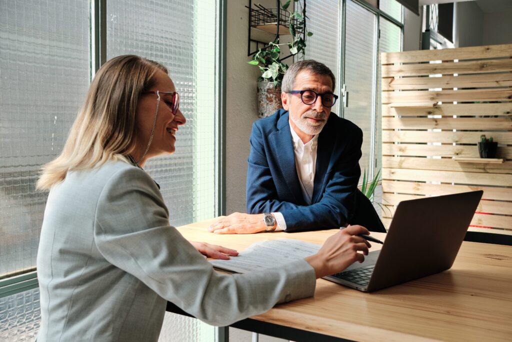 A financial advisor meeting with clients