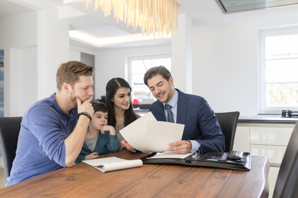 Consultant reviewing financials to family at home