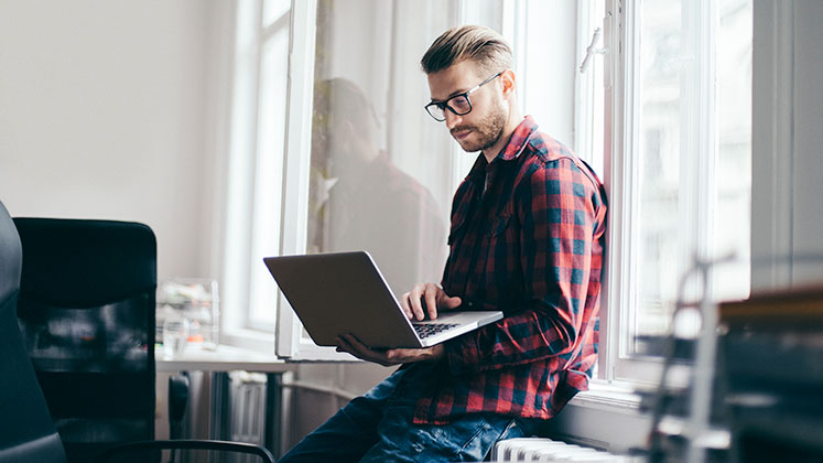 Man holding a laptop