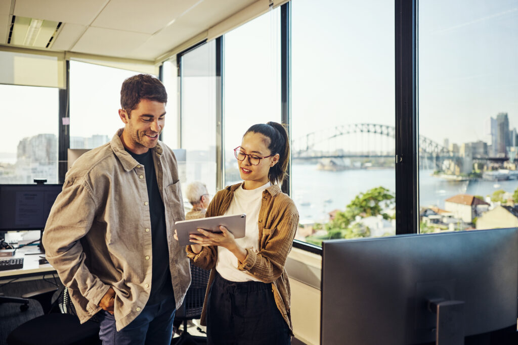 Business partners collaborating with a tablet in the office