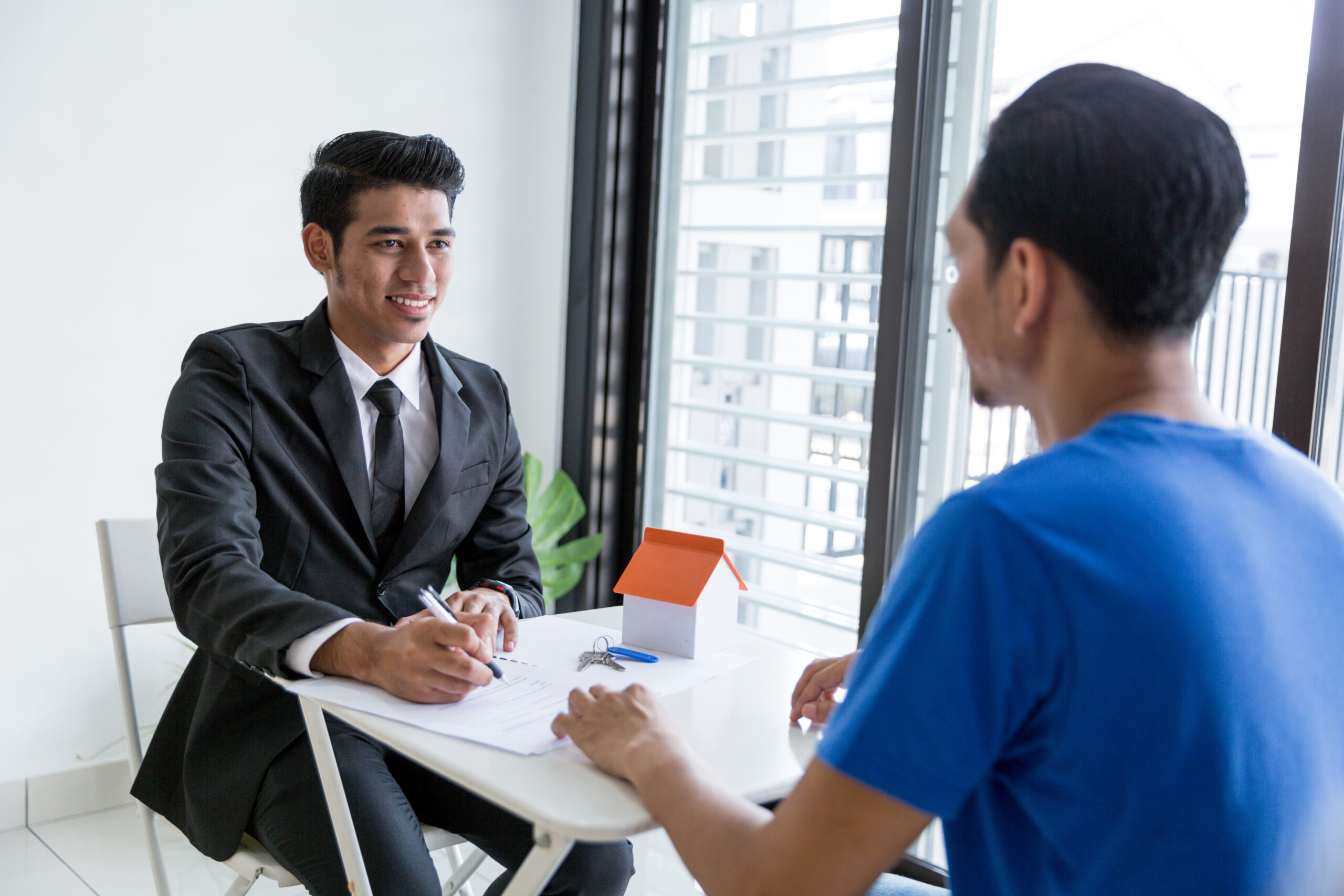 Office worker talking with a client in an office