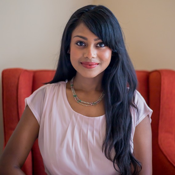 Headshot photo of Deepika Pillai looking at the camera