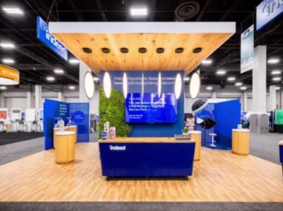 Indeed's booth at the event. A brightly lit booth in a conference center