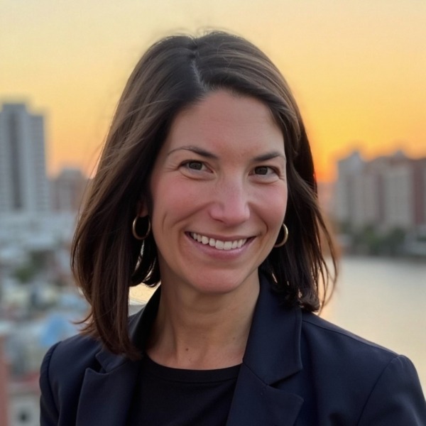 Headshot photo of Emily Parmelee looking at the camera