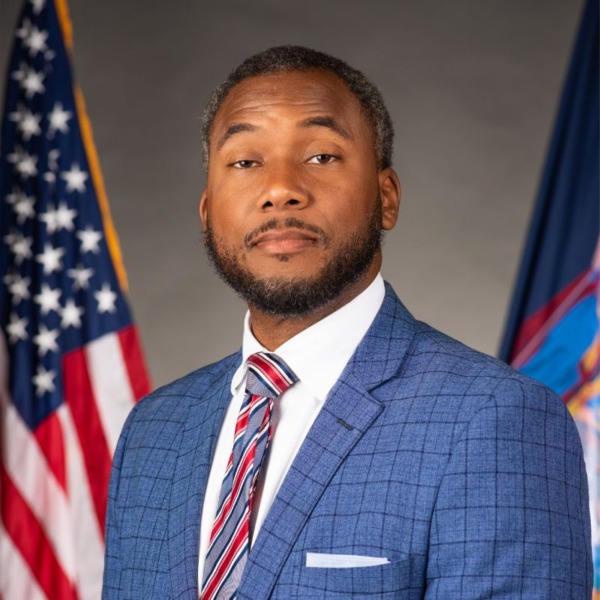 Headshot photo of Timothy R. Hogues looking at the camera