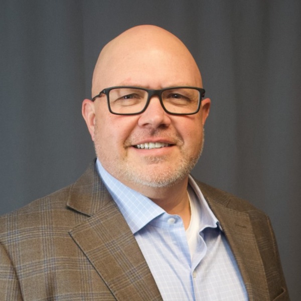 Headshot photo of Neil Costa looking at the camera