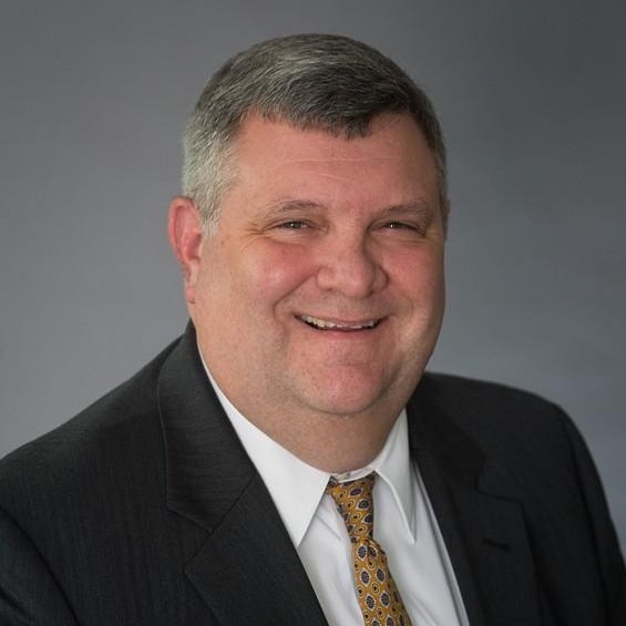 Headshot photo of Trey Hodgkins looking at the camera