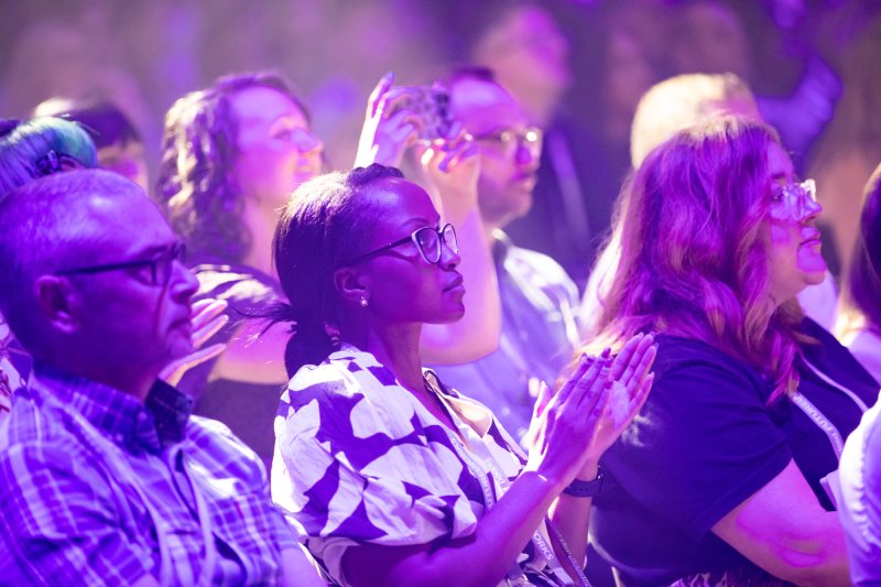 Applauding audience at a large event