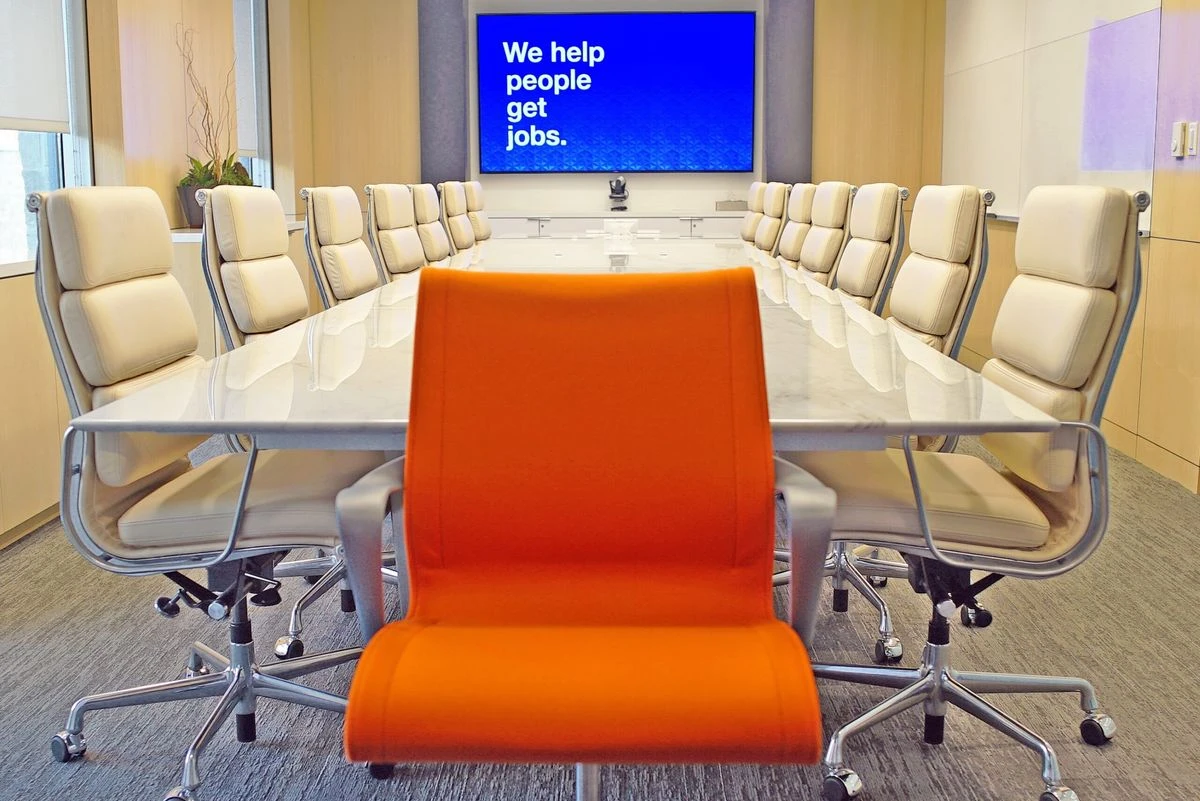 An orange chair in Indeed's meeting rooms signifies how job seekers are considered in product and business decisions.